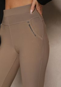 Renee - Jasnobrązowe Spodnie Typu Skinny High Waist Ozdobione Cyrkoniami Lavilara. Okazja: na co dzień. Stan: podwyższony. Kolor: brązowy. Wzór: aplikacja. Styl: casual, elegancki