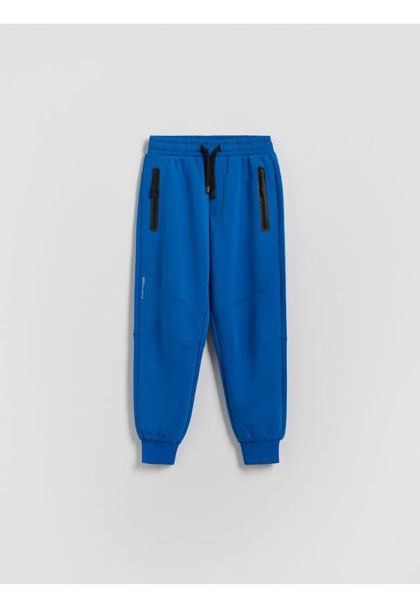 Reserved - Dzianinowe joggery - niebieski. Kolor: niebieski. Materiał: dzianina
