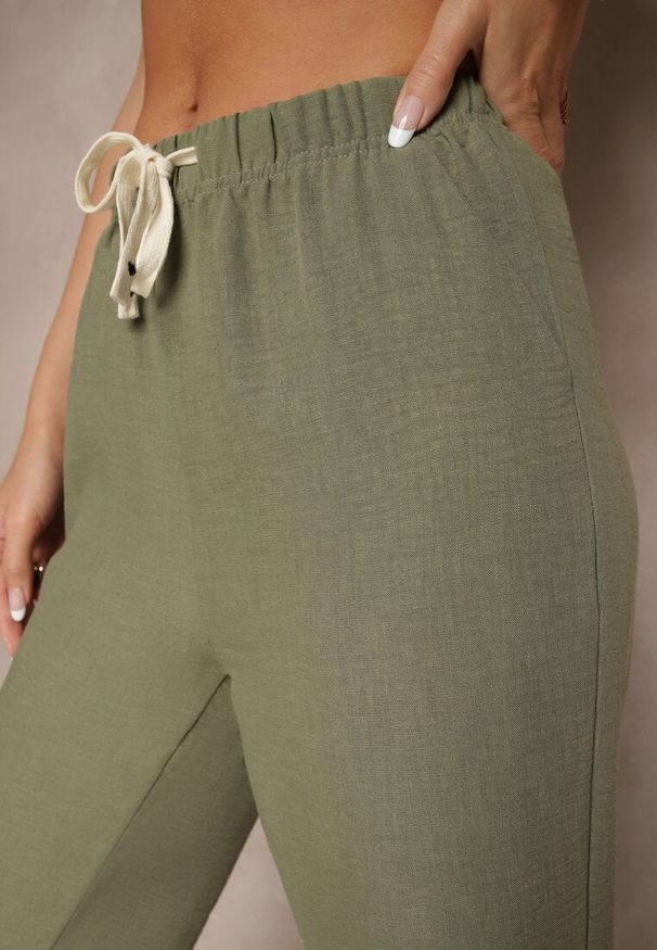 Renee - Ciemnozielone Spodnie High Waist z Szeroką Nogawką i Gumką w Pasie Mirarena. Okazja: na co dzień, na spotkanie biznesowe, do pracy. Stan: podwyższony. Kolor: zielony. Styl: biznesowy, elegancki, casual