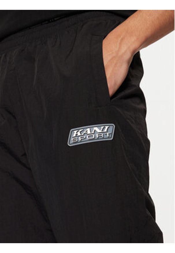 Karl Kani Spodnie dresowe Sport Patch Essential 60030077 Czarny Relaxed Fit. Kolor: czarny. Materiał: syntetyk