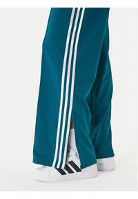 Adidas - adidas Spodnie dresowe Firebird KG3701 Zielony Loose Fit. Kolor: zielony. Materiał: syntetyk #3