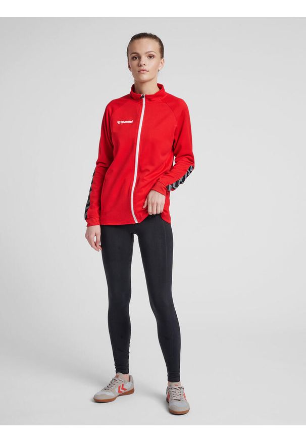 Kurtka damska Hummel Zip hmlAUTHENTIC Poly. Kolor: czerwony, różowy, wielokolorowy. Materiał: poliester. Sport: fitness, piłka ręczna