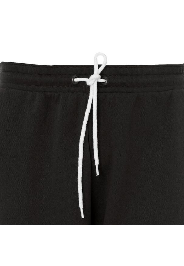 UHLSPORT - Nowe spodnie dresowe dla dzieci Uhlsport Essential. Kolor: wielokolorowy, biały, czarny. Materiał: dresówka. Sport: piłka nożna