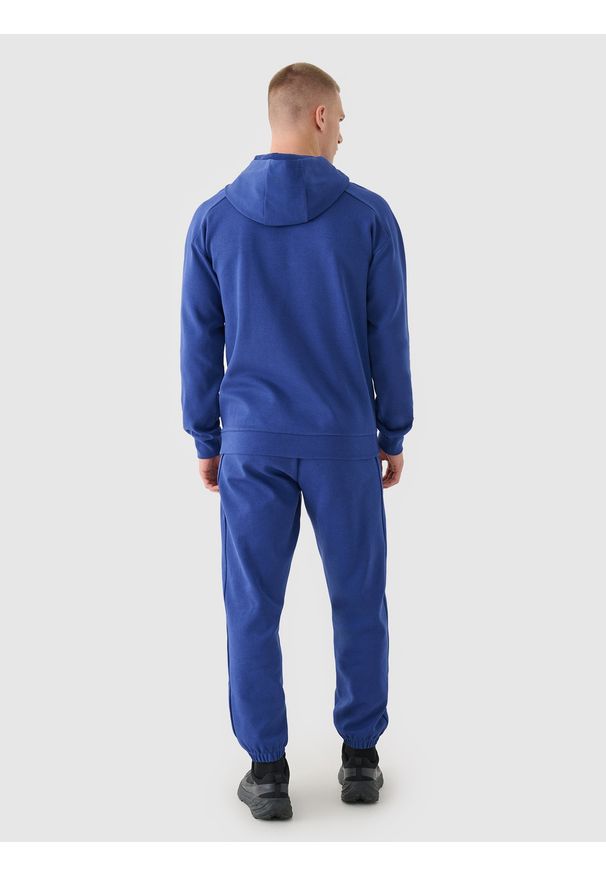 4f - 4F Spodnie dresowe joggery męskie - granatowe L. Kolor: niebieski. Materiał: dresówka. Wzór: ze splotem, gładki. Sport: fitness