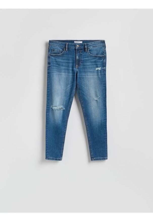 Reserved - Jeansy skinny z przetrciami - niebieski. Kolor: niebieski