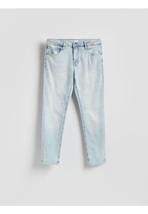 Reserved - Jeansy slim z efektem sprania - niebieski. Kolor: niebieski