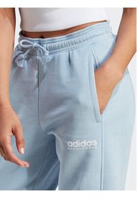 Adidas - adidas Spodnie dresowe All SZN Fleece Graphic IL3244 Błękitny Loose Fit. Kolor: niebieski. Materiał: bawełna