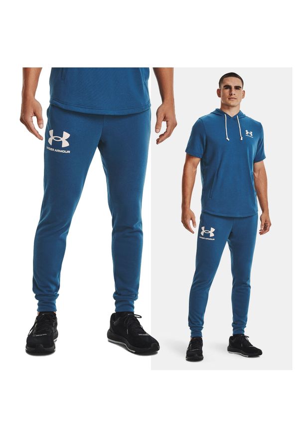 Under Armour - Spodnie dresowe męskie UNDER ARMOUR 1361642. Kolor: niebieski. Materiał: dresówka