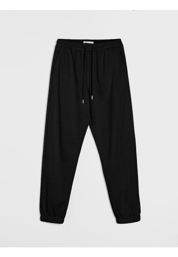 Sinsay - Dresowe spodnie jogger terry - czarny. Kolor: czarny. Materiał: dresówka