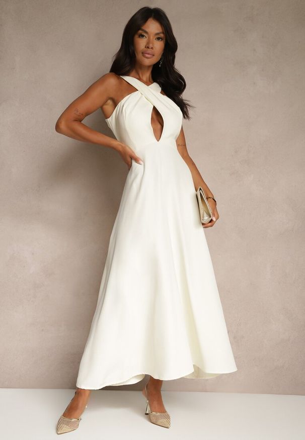 Renee - Żółta Koktajlowa Sukienka z Wiskozą i Dekoltem Halter Dolmanna. Typ kołnierza: dekolt halter. Kolor: żółty. Materiał: wiskoza. Styl: wizytowy