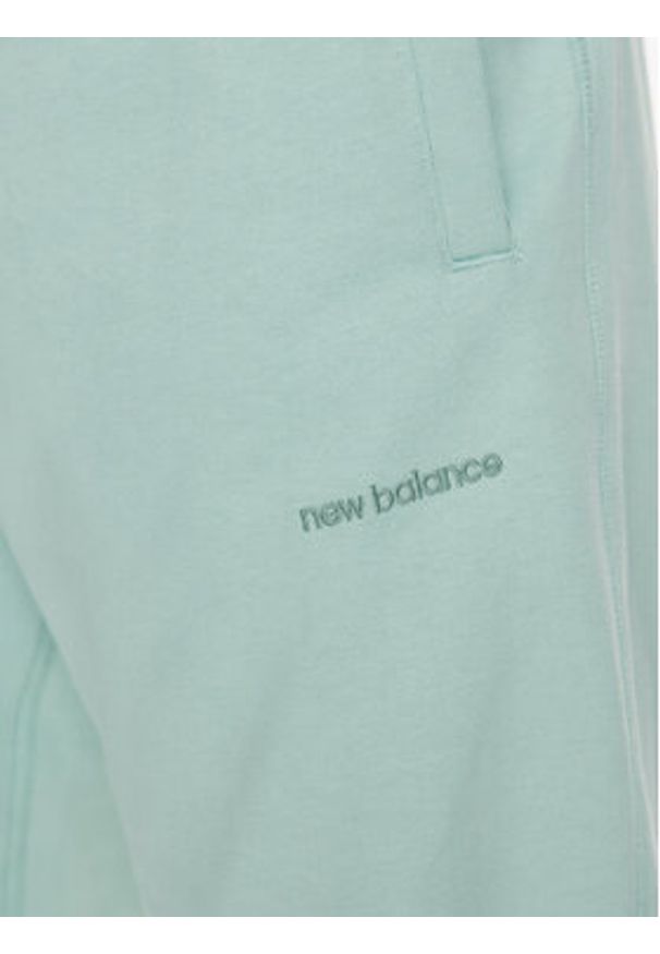 New Balance Spodnie dresowe MP23551 Zielony Relaxed Fit. Kolor: zielony. Materiał: bawełna