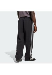 Adidas - adidas Spodnie dresowe adicolor Spacer Track JX1506 Czarny Baggy Fit. Kolor: czarny. Materiał: bawełna. Sport: turystyka piesza #3
