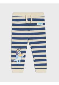 Sinsay - Spodnie Bluey - kremowy. Kolor: kremowy #1