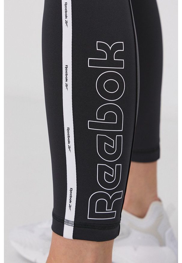 Reebok Legginsy damskie kolor czarny z aplikacją. Kolor: czarny. Materiał: dzianina. Wzór: aplikacja