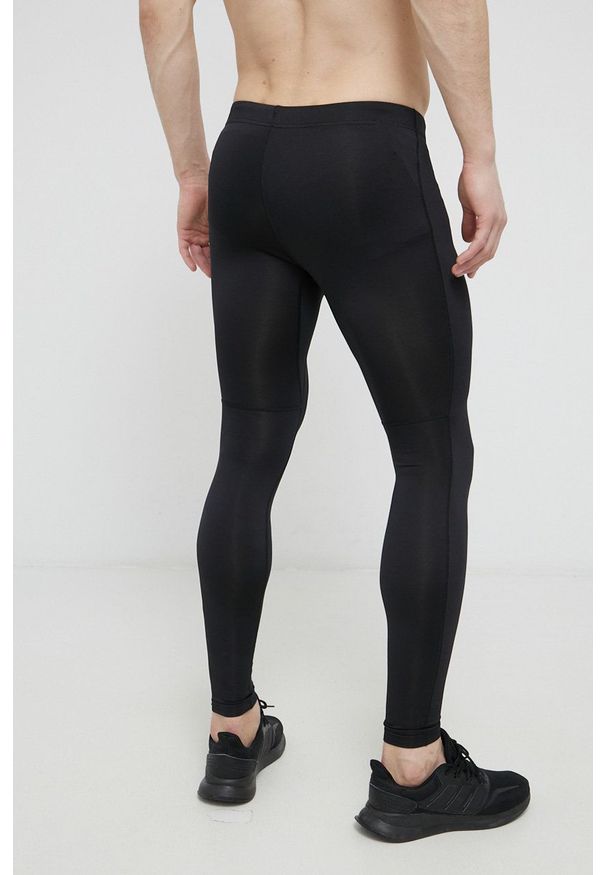 Asics Legginsy męskie kolor czarny gładkie. Kolor: czarny. Materiał: dzianina. Wzór: gładki