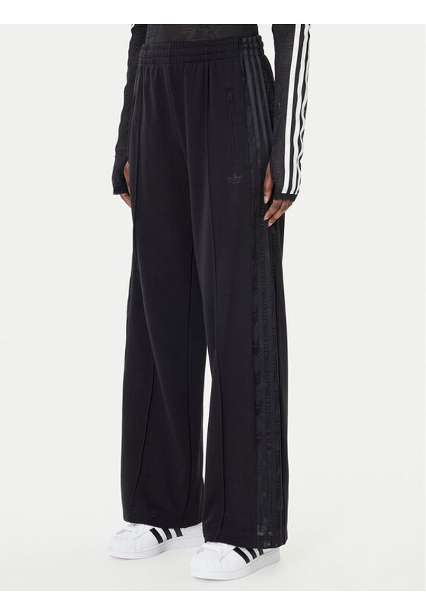 Adidas - adidas Spodnie dresowe Firebird Lace KD0351 Czarny Loose Fit. Kolor: czarny. Materiał: syntetyk, bawełna