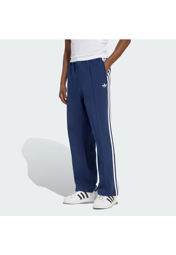 Adidas - adidas Spodnie dresowe adicolor Spacer Track KD4087 Granatowy Baggy Fit. Kolor: niebieski. Materiał: syntetyk. Sport: turystyka piesza