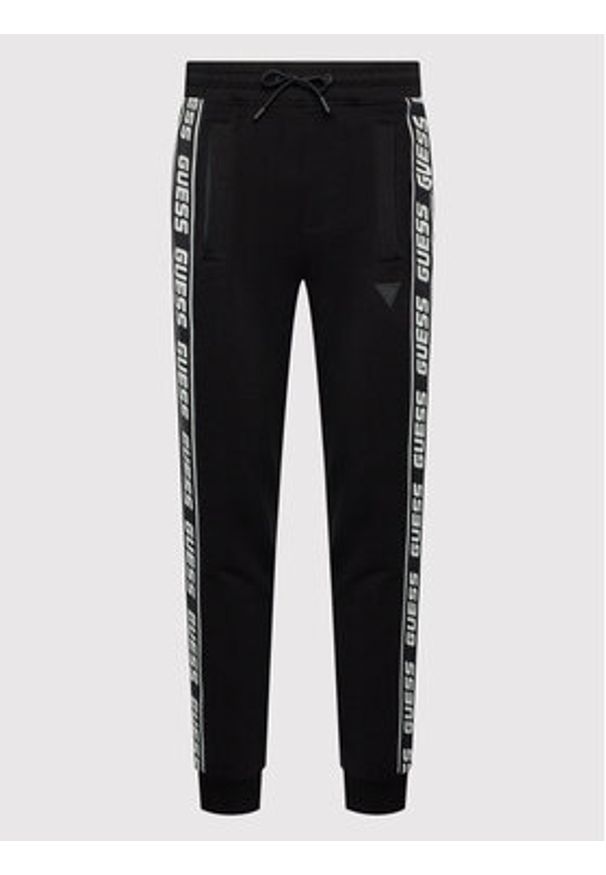 Guess Spodnie dresowe Z2YB19 K6ZS1 Czarny Regular Fit. Kolor: czarny. Materiał: bawełna