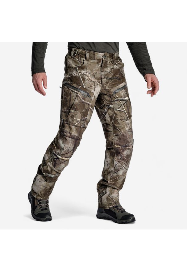 SOLOGNAC - Spodnie Solognac Warm 900 camo treemetic wodoodporne. Kolor: wielokolorowy, brązowy, zielony. Materiał: skóra, materiał, tkanina, polar. Sport: outdoor