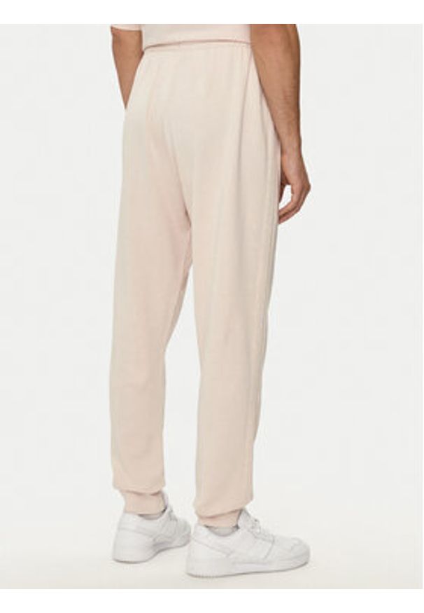 Adidas - adidas Spodnie dresowe ALL SZN 3-Stripes IR5201 Różowy Regular Fit. Kolor: różowy. Materiał: bawełna