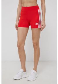 adidas Originals - Adidas Originals Szorty damskie kolor czerwony gładkie high waist. Stan: podwyższony. Kolor: czerwony. Materiał: dzianina, materiał. Wzór: gładki