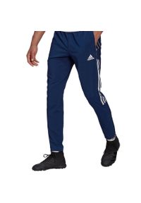 Adidas - Spodnie męskie adidas Tiro 21 Woven. Kolor: wielokolorowy, biały, niebieski