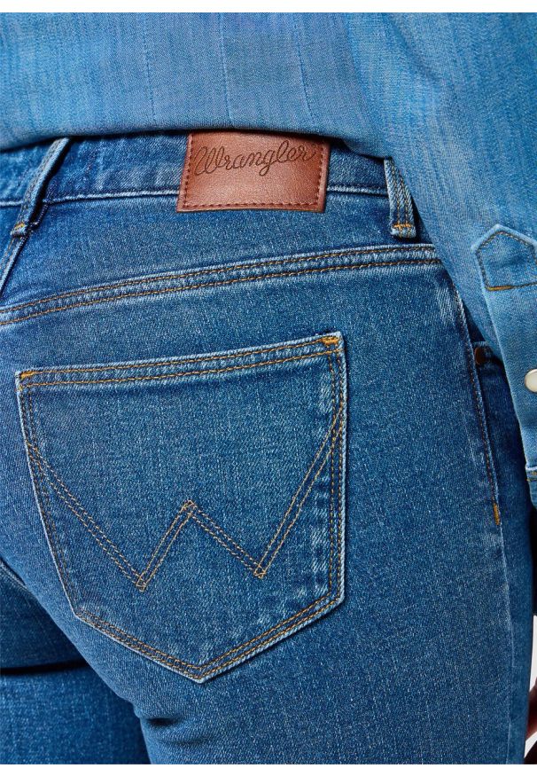 Wrangler - DAMSKIE SPODNIE WRANGLER BOOTCUT VINTAGE BLUE 112356394. Styl: vintage