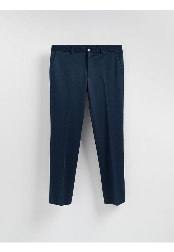 Reserved - MEN`S TROUSERS - granatowy. Kolor: niebieski. Materiał: dzianina