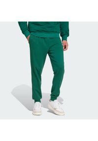 Adidas - Spodnie Essentials Feel Cozy French Terry. Kolor: wielokolorowy, czarny, zielony. Materiał: dresówka, materiał