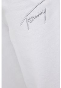 Tommy Jeans spodnie damskie kolor biały gładkie. Kolor: biały. Materiał: dzianina, materiał. Wzór: gładki