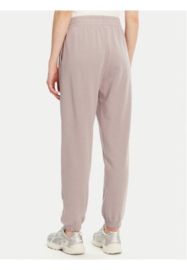 Under Armour Spodnie dresowe Ua Rival 1382735 Beżowy Loose Fit. Kolor: beżowy. Materiał: bawełna