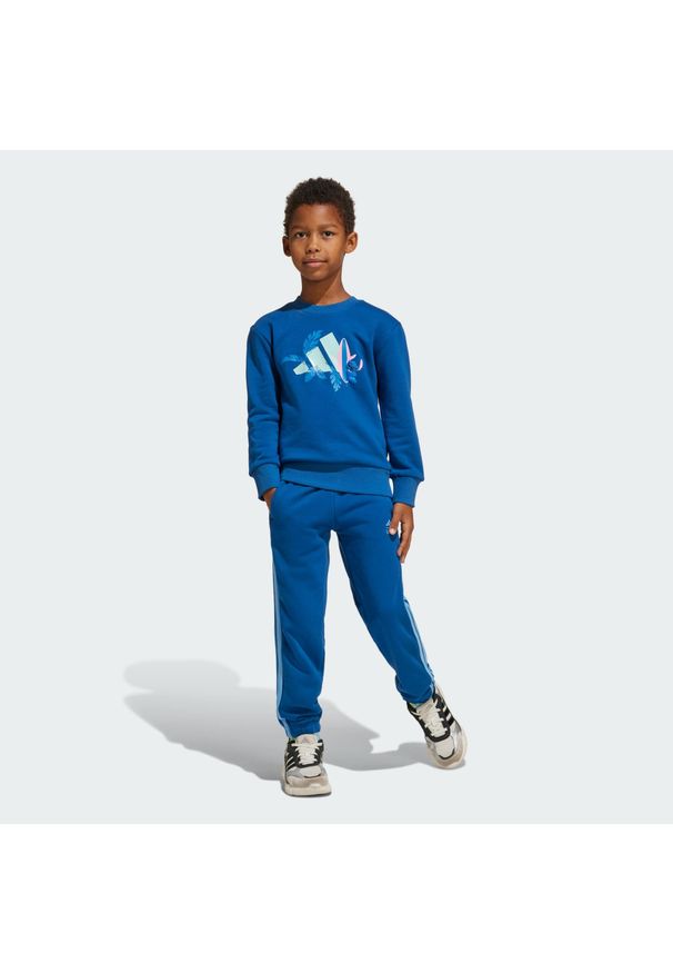 Adidas - Zestaw adidas Disney Lilo & Stitch Jogger Kids. Kolor: niebieski. Materiał: dresówka, bawełna. Wzór: motyw z bajki
