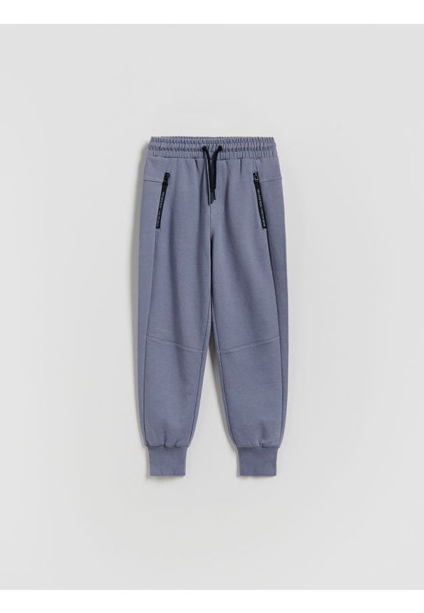 Reserved - Bawełniane spodnie jogger - niebieski. Kolor: niebieski. Materiał: bawełna