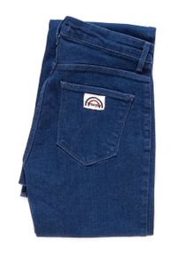 Wrangler - DAMSKIE SPODNIE JEANSOWE WRANGLER FLARE RINSEWASH W23361023. Stan: podwyższony. Wzór: jednolity. Styl: vintage