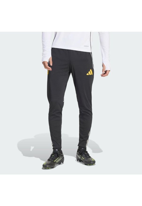 Adidas - Spodnie treningowe adidas Real Madrid Avengers 25/26 Tiro 25 Competition. Kolor: żółty, czarny, wielokolorowy, biały. Materiał: tkanina. Wzór: motyw z bajki. Sport: piłka nożna