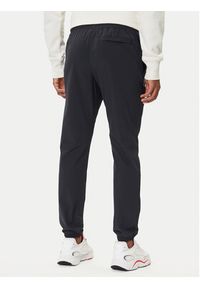 Under Armour Spodnie dresowe UA Vibe Woven 1386557 Czarny Regular Fit. Kolor: czarny. Materiał: syntetyk #3