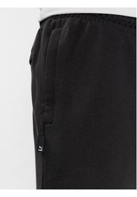 Puma Spodnie dresowe Team 538261 Czarny Relaxed Fit. Kolor: czarny. Materiał: bawełna