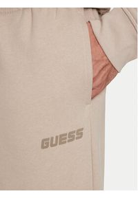 Guess Spodnie dresowe Emis Z4YB00 KAIJ1 Beżowy Relaxed Fit. Kolor: beżowy. Materiał: bawełna #4