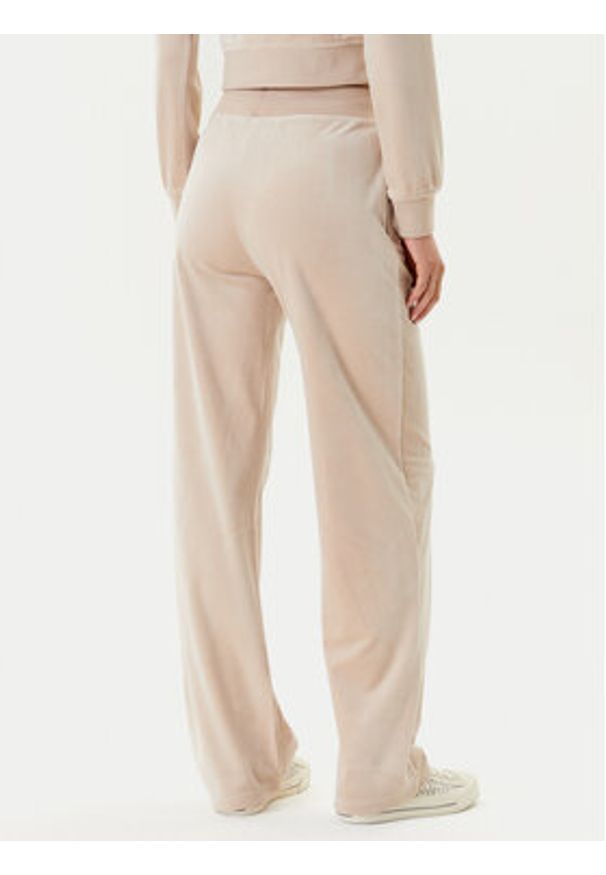 Guess Spodnie dresowe V3BB26 K0232 Beżowy Regular Fit. Kolor: beżowy. Materiał: syntetyk