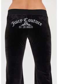 Juicy Couture - JUICY COUTURE Czarne spodnie Arched Metallic Layla. Kolor: czarny