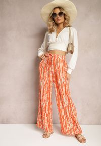 Renee - Pomarańczowe Spodnie z Szerokimi Nogawkami z Abstrakcyjnym Wzorem i Gumką w Pasie Sarieta. Kolor: pomarańczowy #1