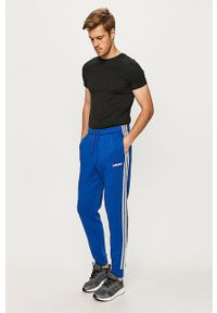 Adidas - adidas - Spodnie. Kolor: niebieski. Materiał: bawełna, poliester, dzianina. Wzór: nadruk, aplikacja #3