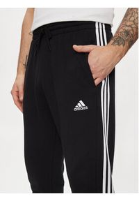 Adidas - adidas Spodnie dresowe Essentials French Terry Tapered Cuff 3-Stripes Joggers HA4337 Czarny Regular Fit. Kolor: czarny. Materiał: bawełna #6