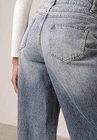 Born2be - Niebieskie Bawełniane Jeansy Typu Palazzo Ozdobione Przetarciami i Dziurami Erivaine. Okazja: na co dzień. Stan: podwyższony. Kolor: niebieski. Wzór: aplikacja. Styl: casual, elegancki #7