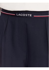 Lacoste Spodnie materiałowe HF5307 Granatowy Relaxed Fit. Kolor: niebieski. Materiał: syntetyk #3