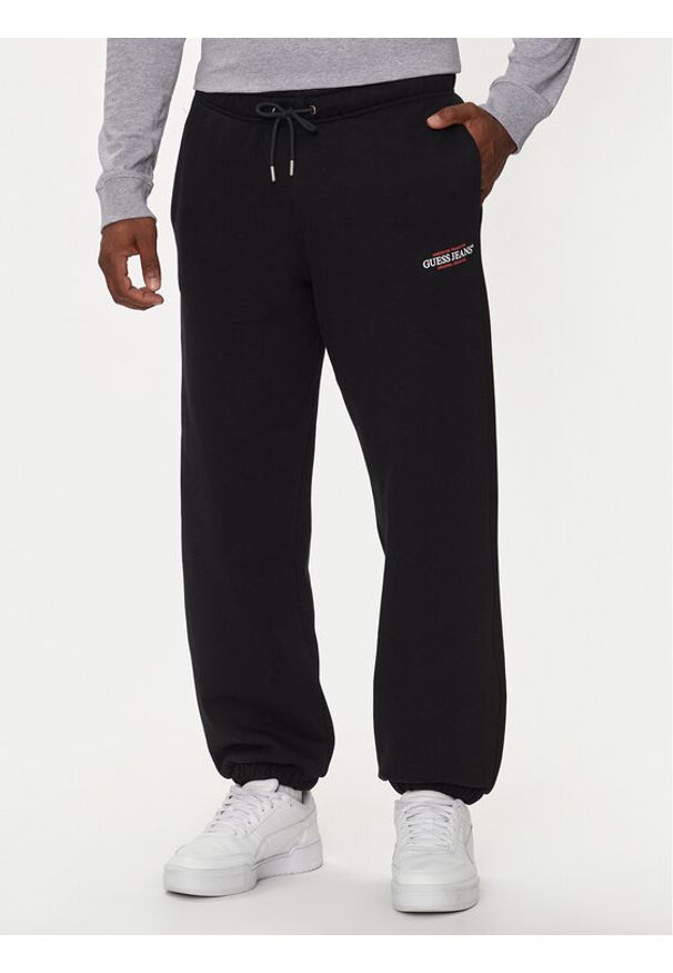Guess Jeans Spodnie dresowe M4YB18 K9V31 Czarny Regular Fit. Kolor: czarny. Materiał: bawełna