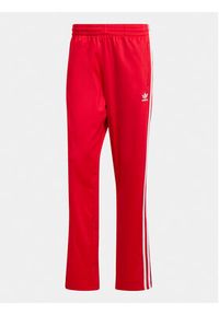 Adidas - adidas Spodnie dresowe adicolor Classics Firebird IJ7057 Czerwony Regular Fit. Kolor: czerwony. Materiał: syntetyk
