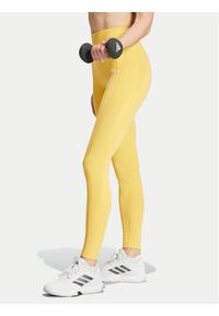 Adidas - adidas Legginsy Optime IT9111 Żółty Slim Fit. Kolor: żółty. Materiał: syntetyk