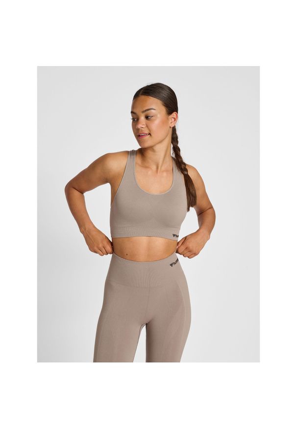 Damski bezszwowy biustonosz sportowy Hummel Tif. Kolor: szary, brązowy, zielony, wielokolorowy, beżowy. Materiał: materiał. Sport: joga i pilates, fitness