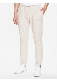 Ellesse Spodnie dresowe Coperchiata SHR17563 Beżowy Regular Fit. Kolor: beżowy. Materiał: bawełna, dresówka